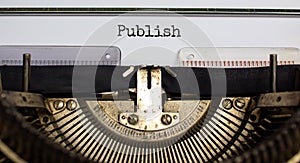 Publish symbol. The word `publish` typed on retro typewriter. Business, publish concept. Beautiful background