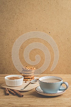 pudding with cinnamon, stacked chip cookies and a cup of coffee/pudding with cinnamon, stacked chip cookies and a cup of coffee on