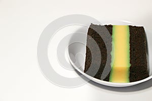 Pudding-covered sponge cake or chocolate-covered sponge cake. Selective focus.