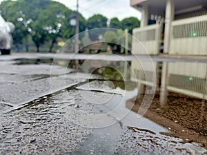 Puddle and building reflections.