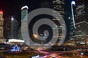 Pudong district and Modern skyscrapers in Shanghai by night. Urban architecture in China