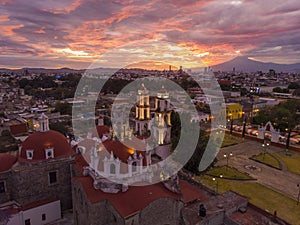 Puebla at Dramatic evening Sunset aerial drone shot of City Center in Puebla de Zaragoza, Puebla State, Mexico photo