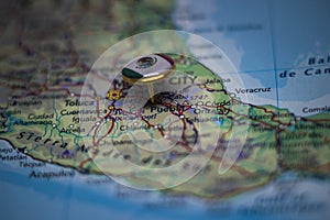 Puebla pinned on a map with the flag of Mexico