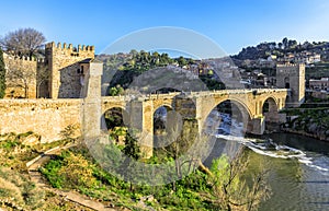 Puente de San Martin bridge over the Tajo river in Toledo, Spain photo