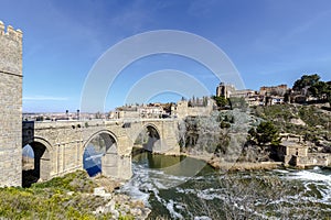Puente de San Martin bridge over the Tajo river in Toledo photo
