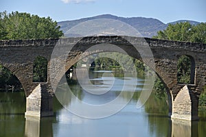 Puente la Reina, Spain - 31 Aug, 2022: Arches of the roman Puente la Reina foot bridge, Navarre, Spain