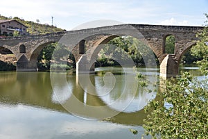 Puente la Reina, Spain - 31 Aug, 2022: Arches of the roman Puente la Reina foot bridge, Navarre, Spain