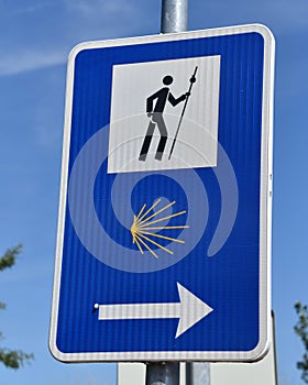 Puente la Reina, Spain - 31 Aug, 2022: Signpost marking directions for pligrims on the El Camino de Santiago footpath