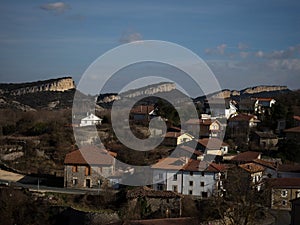 Puentedey village with limestone cliff rock formations mountains Merindad de Valdeporres Burgos Castilla Leon Spain photo
