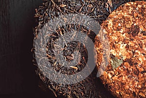 Puer tea background. Pu-erh cakes dark color and floral leaf tea. Traditional chinese beverage and popular antioxidant