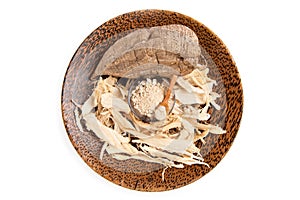 Pueraria mirifica or white kwao krua fruit ,dried slices and powder isolated on background. top view ,flat lay