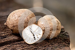 Pueraria mirifica or white kwao krua fruit and slices on an old wood background