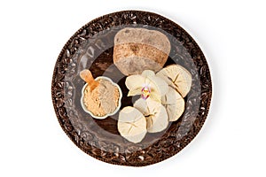 Pueraria mirifica or white kwao krua fruits and powder isolated on white background.top view,flat lay