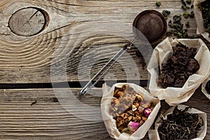 Puerh, fruit and black tea on wooden table