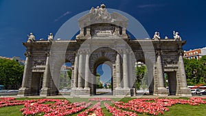 The Puerta de Alcala timelapse hyperlapse is a Neo-classical monument in the Plaza de la Independencia in Madrid, Spain. photo
