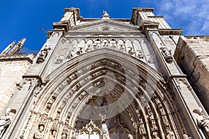 Puerta de los Leones (Portal of the Lions), richly decorated carved Gothic facade of the Toledo Cathedral, Spain.