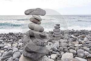 Puerto de la Cruz. Stone piles Cairns on Playa Jardin, Peurto de la Cruz, Tenerife, Canary Islands, Spain. Selfmade rock-monume