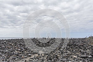 Puerto de la Cruz. Stone piles Cairns on Playa Jardin, Peurto de la Cruz, Tenerife, Canary Islands, Spain. Selfmade rock-monume