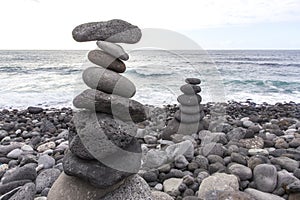 Puerto de la Cruz. Stone piles Cairns on Playa Jardin, Peurto de la Cruz, Tenerife, Canary Islands, Spain. Selfmade rock-monume