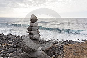 Puerto de la Cruz. Stone piles Cairns on Playa Jardin, Peurto de la Cruz, Tenerife, Canary Islands, Spain. Selfmade rock-monume