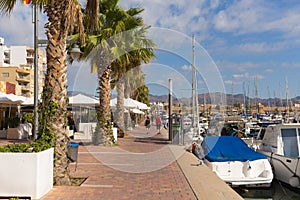 Puerto de Mazarron harbour Murcia Spain with cafes and palm trees