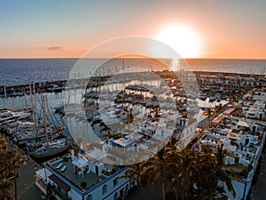 Puerto de Mogan fishing town aerial view at sunset.