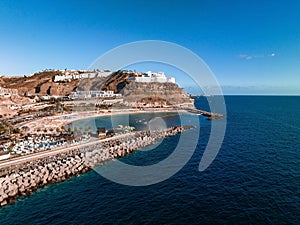 Puerto de Mogan fishing town aerial view at sunset.