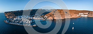 Puerto de Mogan fishing town aerial view at sunset.