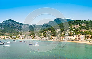 Puerto de Soller, Port of Mallorca island in balearic islands, Spain. Beautiful  beach and bay with boats in clear blue water of