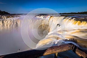 Puerto Iguazu - June 24, 2017: The Devil`s Throat site at the Iguazu Waterfalls, Wonder of the world, at Puerto Iguazu, Argentina