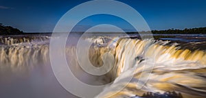 Puerto Iguazu - June 24, 2017: The Devil`s Throat site at the Iguazu Waterfalls, Wonder of the world, at Puerto Iguazu, Argentina