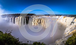 Puerto Iguazu - June 24, 2017: The Devil`s Throat site at the Iguazu Waterfalls, Wonder of the world, at Puerto Iguazu, Argentina