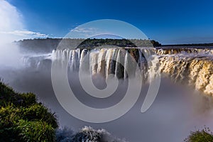 Puerto Iguazu - June 24, 2017: The Devil`s Throat site at the Iguazu Waterfalls, Wonder of the world, at Puerto Iguazu, Argentina