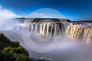 Puerto Iguazu - June 24, 2017: The Devil`s Throat site at the Iguazu Waterfalls, Wonder of the world, at Puerto Iguazu, Argentina