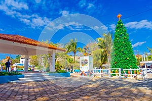 Puerto Morelos, Mexico - January 10, 2018: Outdoor view of a huge christmast tree in the park in Puerto Morelos, Yucatan