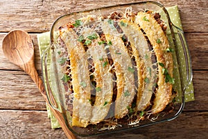 Puerto Rican food casserole Pastelon de Platano Maduro close-up in a baking dish. Horizontal top view photo