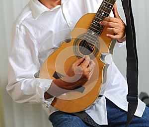 Puerto Rico Cuatro Player with white shirt. photo