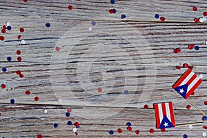 puerto Rico independence day. day of constitution 25 July. the concept of veterans Day or memorial. mini flags and confetti on