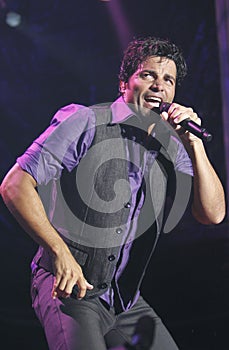 Puerto Rico latin singer Chayanne gesturing live on stage vertical