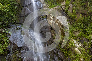 PUERTO VALLARTA MEXICO SEPTEMBER 11 ,2019:Waterfall in Yelapa, tropical beach tourists swimming under the waterfall during their