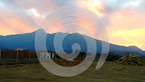 Puesta de sol tras el Nevado de Colima photo