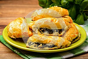 Puff pastries with spinach and cheese.