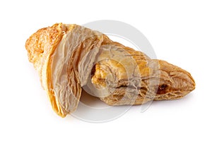 Puff pastry buns isolated over white background