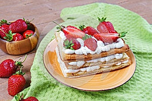 Puff pastry cake with whipped curd cream and fresh strawberries