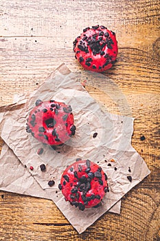 Puff pastry donuts with pink icing and cookie chips