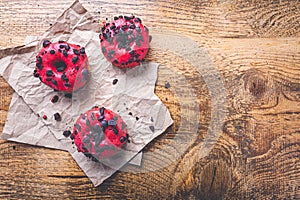 Puff pastry donuts with pink icing and cookie chips