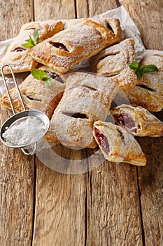 Puff pastry filled with cherry jam close-up. Vertical