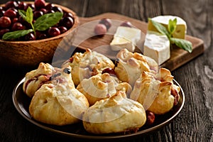 Puff pastry pies with camembert cheese and cranberries.