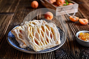 Puff pastry pies filled with apricot jam and cottage cheese