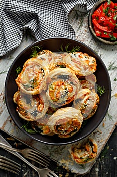 Puff Pastry Pinwheels stuffed with salmon, cheese and spinach in a bowl